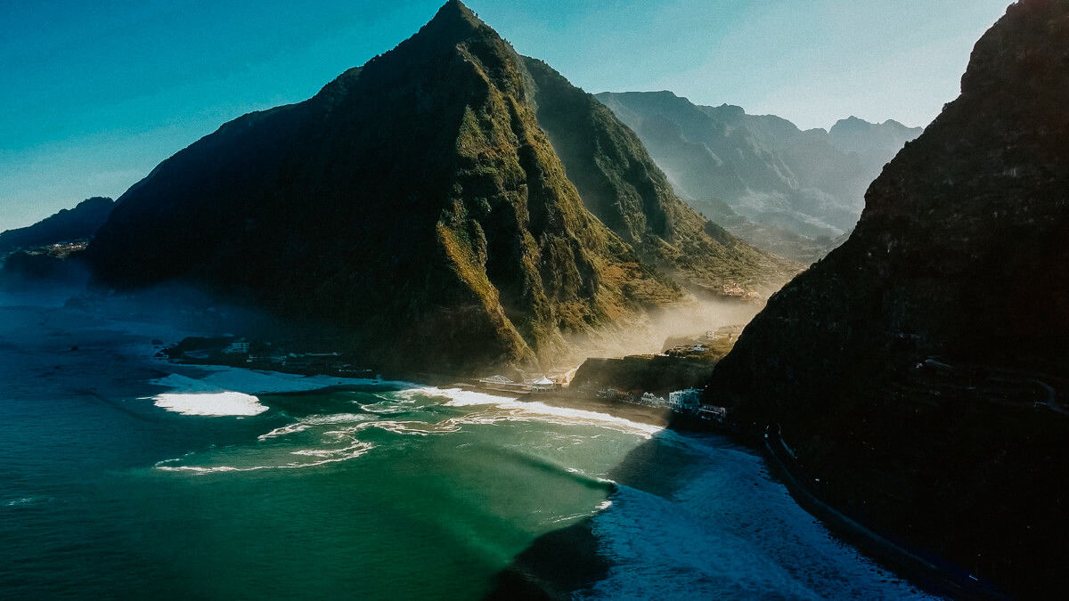 Drone shot of Sao Vicente in dramatic lighting with ocean and mountain view