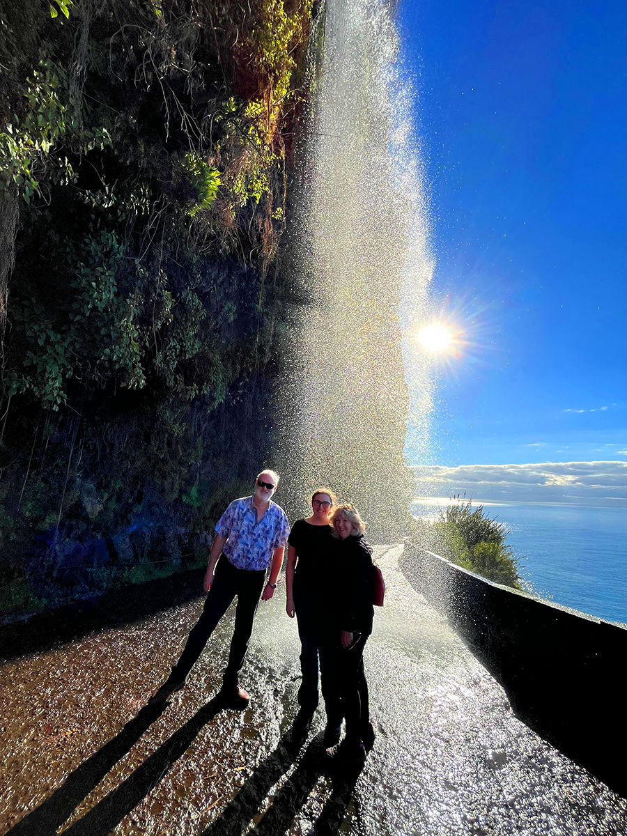 Coast view with small villages and ocean, blue sky in the midday sun